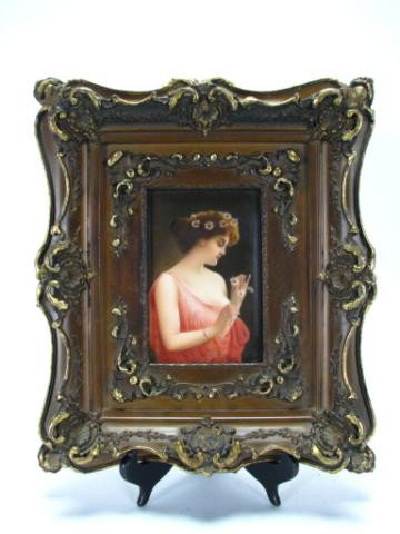 Antique Porcelain Plaque signed Wagner: Antique porcelain plaque signed Wagner, depicting "Marguerite", with embossed ceramics factory mark verso (Austrian?) approximately 6 x 4", in 13.25 x 11.25 early/mid 20th Century frame, signed lower 