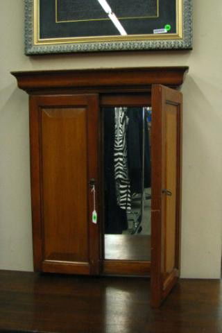 Ethan Allen Hinged Door Wall Mirror: Ethan Allen Hinged Door Wall Mirror with two, raised panel doors and three section mirror, 27" high, 23" wide and 4" deep.