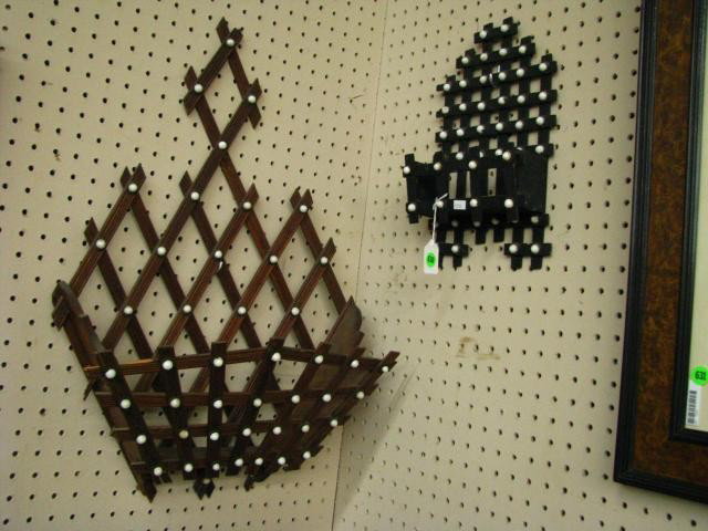 Two Walnut Victorian Wall Racks: Two Walnut Victorian Wall Racks both with white porcelain button decorations, one periodical rack 25" high (with minor damage) and one comb case 13.5" high