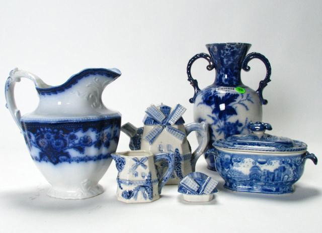 Group of Flow Blue and Blue on White Porcelain: Group of porcelain including flow blue: double handled 10.5 inch floral motif vase, Woodard England handled milk pitcher 8 inches with floral decoration (chip and hairline in spout), lidded handled sa