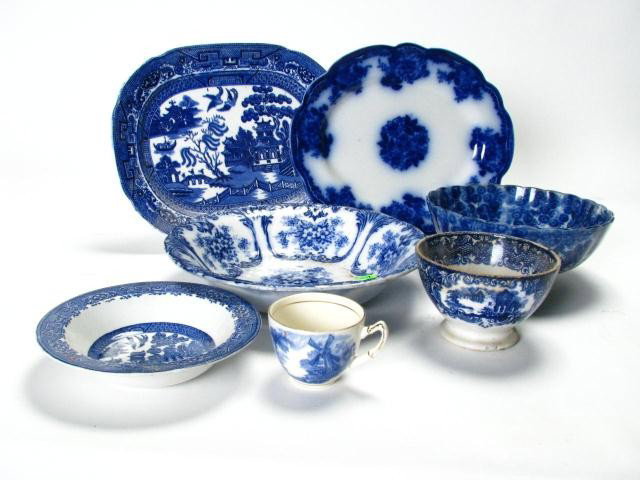 Group of Flow Blue and Blue decorated Porcelain: Group of flow blue and blue decorated porcelain, including 11.5 x 9 inch English Willow serving tray, oval tray, 10 inch deep bowl, blue on white Oriental scalloped bowl, Willow dessert, Abbey Holland