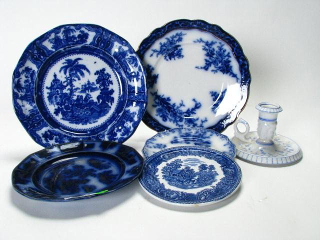 Group of Flow Blue Porcelain, and Blue and White: Group of flow blue and blue decorated porcelain, including two 10 inch dinner plates (non-matching), dessert plate, bread plate, trivet, and a porcelain candle holder with blue vine decoration