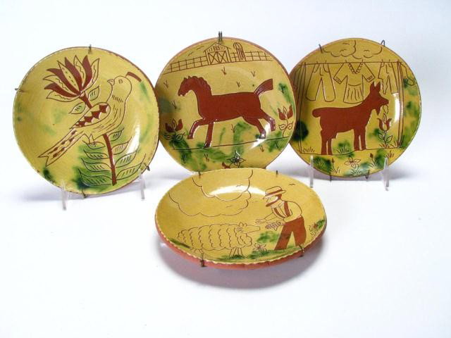 Four Breininger Animal Themed Red Ware Plates: Four Lester Breininger Pennsylvania Red Ware Pottery decorator plates, all signed and dated verso, with weather notation, depicting Amish man with sheep, a goat with a clothes line, a horse in a pastu