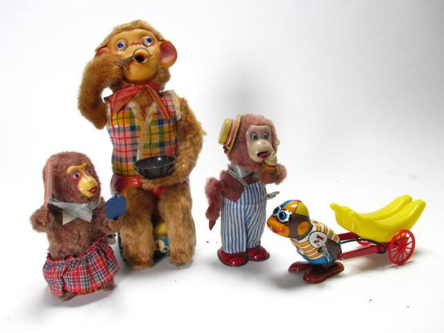 Group of Four, Vintage Mechanical Monkey toys: Group of five vintage mechanical monkey toys, all Japanese, including 'The Monkey Banana Vender', wind-up by Y-One, tested-working, with box, Marusan bear with comb and mirror, no box, tested-working,