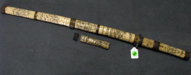Japanese Bone and Brass Mounted Sword and Scabbard: Japanese Bone and Brass Mounted Sword and Scabbard, with carved figural depictions on scabbard and sword hilt, with bronzed mounts (some are loose), approximately 30" long