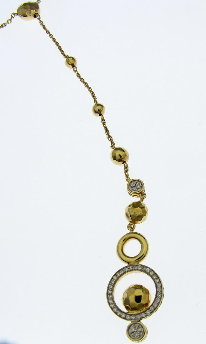 John Hardy 18K Yellow Gold Diamond Slider Necklace: A John Hardy 18K yellow gold dot slider style Y necklace with .15ctw of diamonds. Hammered yellow gold dot slider for adjustable length leads to a drop of yellow gold hammered beads and an open circle