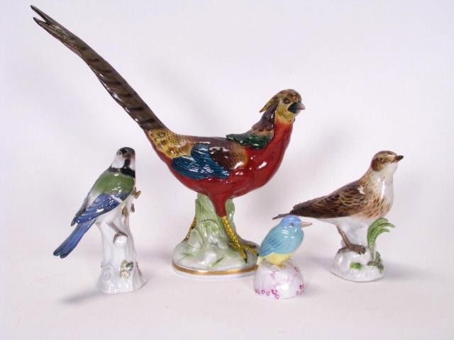 Group of European Porcelain Bird Figures: Group of porcelain, including two Meissen birds, 5.5 inches high (one with leaf damage), pheasant with Beehive mark, 11.5 inches high, and a KPM bluebird, 3 inches high