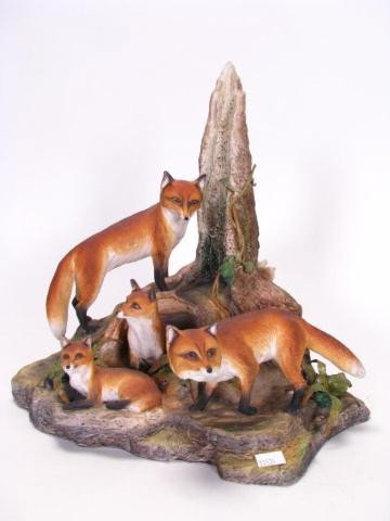 Boehm "Red Fox Family" Porcelain Grouping: Boehm porcelain limited edition animal grouping, depicting four red foxes, "Red Fox Family", one leaf missing on foilage, 12 inches high