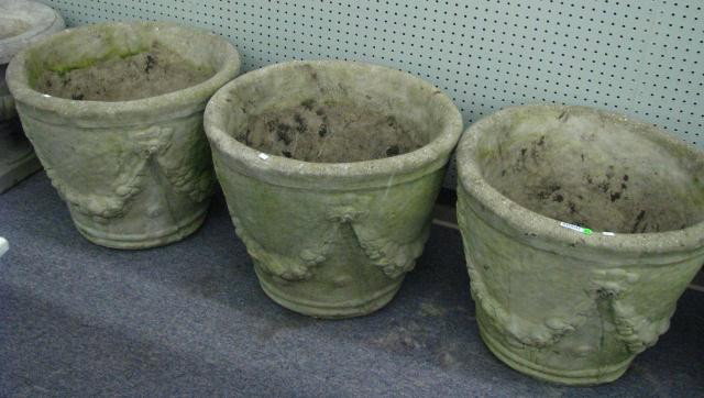 Set of Three, Ornamental Garden Planters: Three cast ornamental concrete planters, 19 inches high, 23 inches diameter, with floral garland motif casting