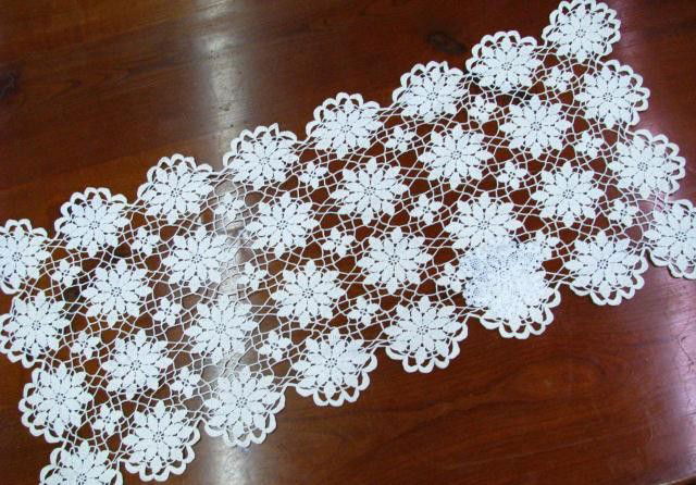 Group of Doilies: Group of approximately twenty-one doilies, some crochet, some knit, includes table runners and doilies ranging in size from 4.5" diameter to 53" long