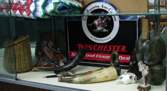 Group of Duck and Western Theme Collectibles: Group of duck-themed decor, lamp, brass bookends, mallard decoys (plastic), stone carving, powderhorn, horn handle knife, fish basket, etc