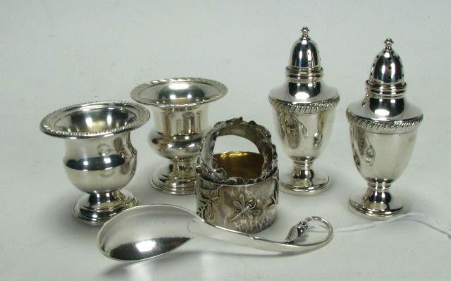Group of Sterling Table Accessories: Group of Sterling Table Accessories including weighted salt & pepper, two napkin rings, cigarette holder, sauce spoon