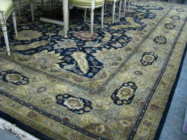 India Agra Wool Room Size Rug: India Agra Wool Room Size Rug, 16' x 11'9", leaf, floral and geometric decoration, navy and dark khaki with accent colors, good condition
