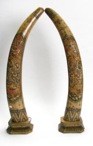 Pair of Carved, Tusk Form Whale Bone: A Pair of Carved, Tusk Form Whale Bone, 29" high with scenic depictions of dragon and oriental figures