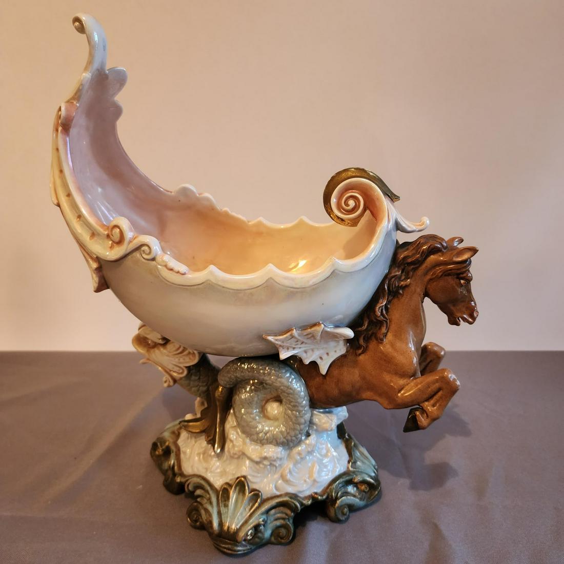 German Porcelain Antique Shell Bowl: A footed bowl, in shell form, carried by a sea horse and other sea creatures, by Rudelstadt, Germany, ca 1900, 14.5"h x 12 x 6.25