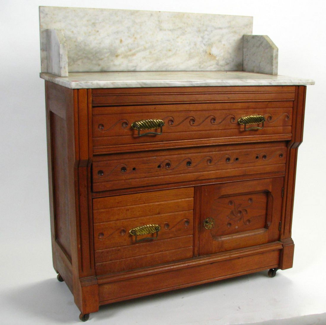 Late Victorian Walnut Wash Stand: Late Victorian Walnut Wash Stand three drawers and one door with white marble top and back splash, 36" tall to top of back splash, 31" wide (top), 15.5" deep