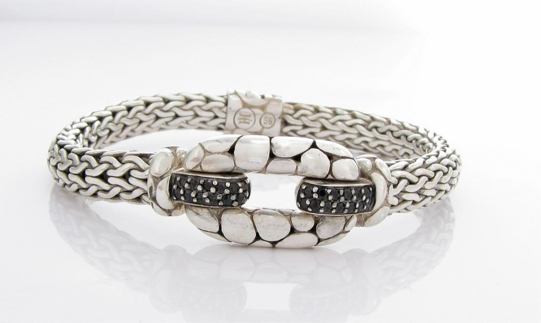 John Hardy Kali Collection Black Sapphire Bracelet: A John Hardy Kali Collect woven bracelet measuring approximately 8mm wide with twenty-four round black sapphires. 7.5" long