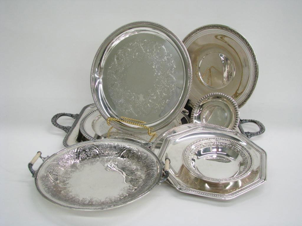 Group of Silverplate Table Accessories: Group of silverplate table accessories, including handled round tray, eight other round serving trays of various sizes, and a handled tea tray