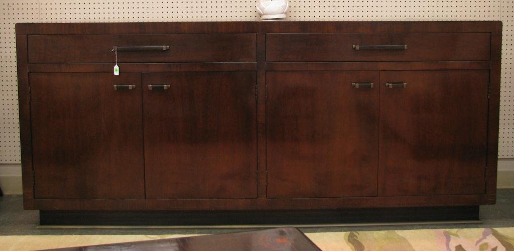 Baker Furniture Buffet: Baker Furniture Buffet, two drawers and four cabinet doors, adjustable interior shelves, silverware liner in one drawer, bronzed hardware, dark walnut finish, 37" high, 22" deep, 84" long