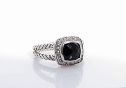 David Yurman Petite Albion Onyx, Diamond Ring: A David Yurman sterling silver Petite Albion ring with a 7mm cushion cut, faceted center onyx, approximately 1.33ct, surrounded by a bezel of round white pave set diamonds, approximately .17ctw. Size