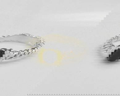 David Yurman Sterling/18K/Onyx Cable Ring: A sterling silver David Yurman cable ring featuring a 4mm onyx bead set in 18K yellow gold mounting. Size 7.5. Retail $300