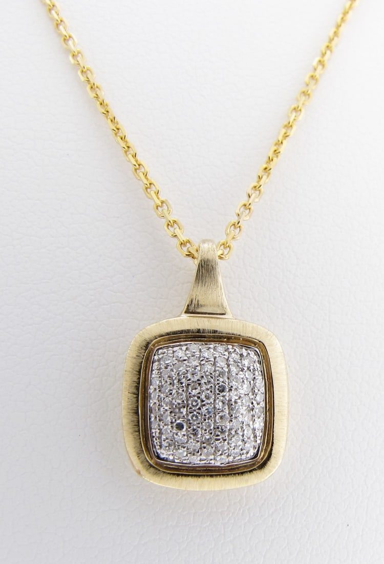 14K Yellow Gold Diamond Pendant and Chain: A 14K yellow gold square pendant featuring sixty-four pave set round white diamonds weighing .14cttw, pendant measures approximately 10.4mm x 15.75mm (including bail), marked 14K on bale, on a 14K yel