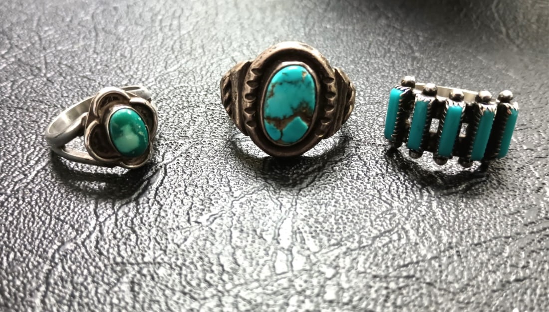 (3) Native American Turquoise and Silver Rings: (3) Native American rings, one with oval turquoise, size 9, with 'LP' makers mark (Possibly Larry Pacheco, Navajo), one with smaller, oval turquoise, size 6.25, unmarked, and one with five turquoise '