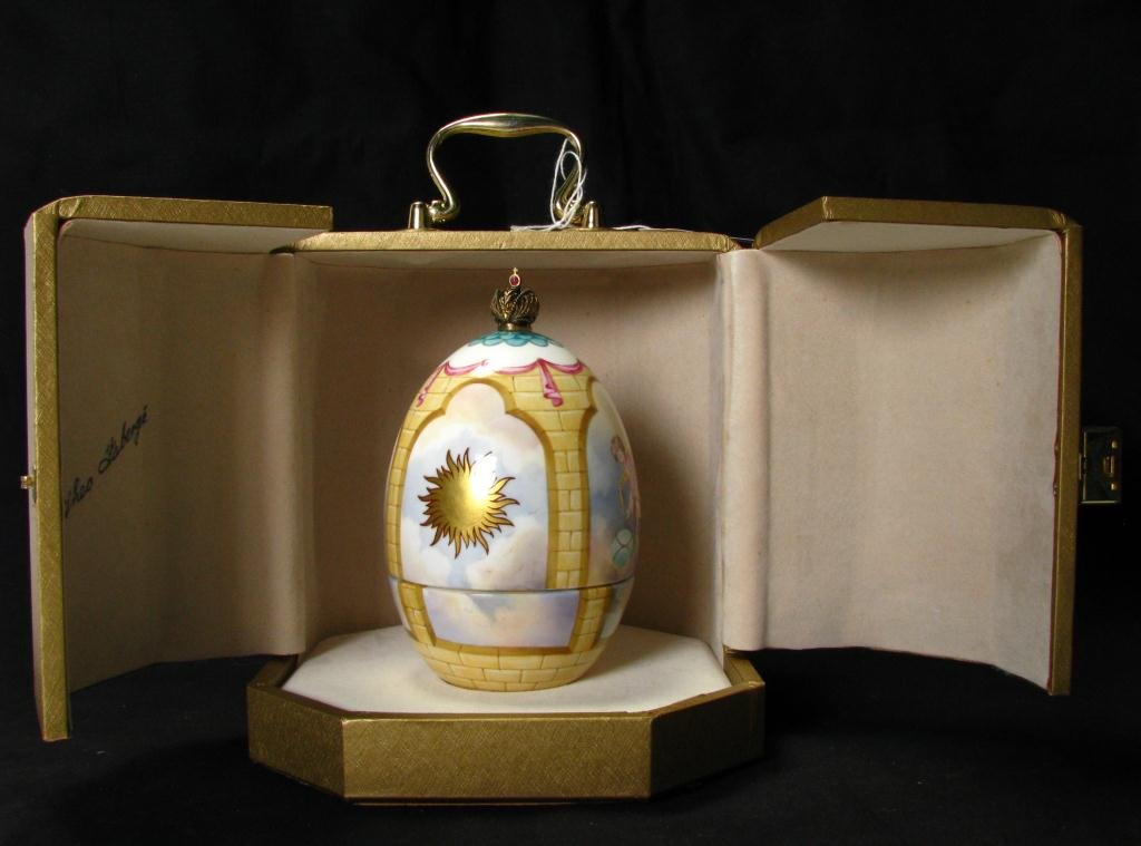 Theo Faberge Phoenix Egg with Box, #103: A limited edition Faberge Phoenix Egg, with display box, from the St Petersburg collection by Theo Faberge, set with a jeweled coronet cross, four panels representing anxiety, tranquility, hope and fu