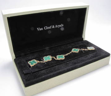 18K Van Cleef & Arpels Alhambra Malachite Bracelet: An 18K yellow gold Van Cleef & Arpels Alhambra malachite bracelet, featuring five four leaf clover charms with milgrain bezels: Each stone is unique, its color and features may vary from one creation