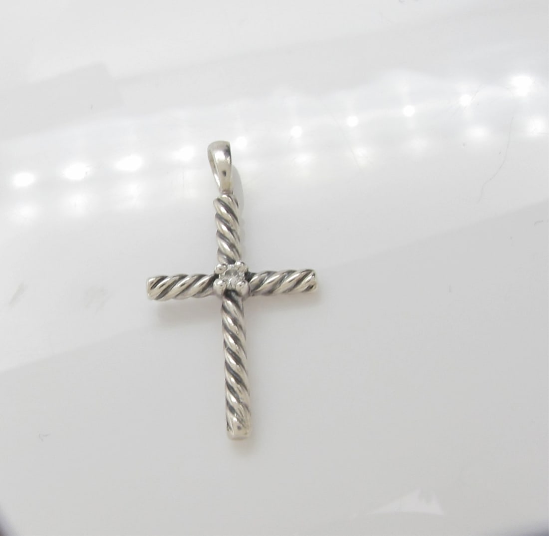 David Yurman Sterling Cable Cross Pendant, Diamond: A David Yurman sterling silver cable cross pendant with .01ct diamond accent. 1" long
