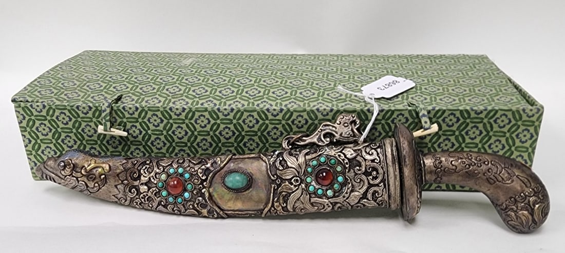 Chinese Replica Dagger: A Chinese replica dagger with jeweled sheath, in form of mythical figure and with turquoise buttons. 14" long. With original box