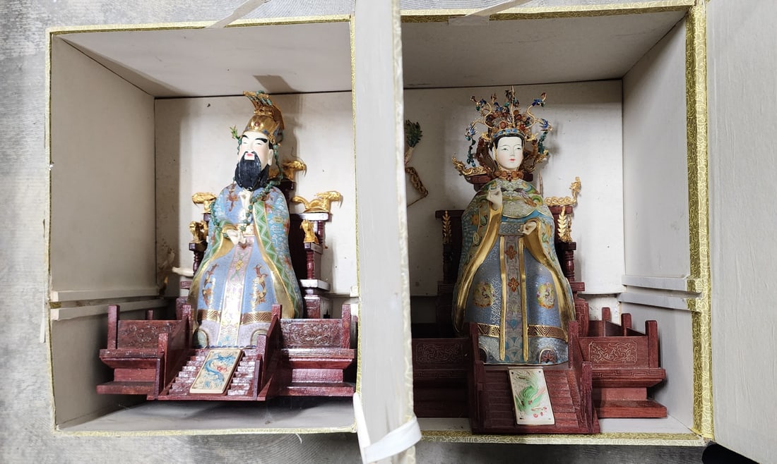 Chinese Emperor and Empress Figures on Thrones: Chinese Emperor and Empress figures, both mounted on wooden throne bases, Cloisonne, jeweled decoration, approx 15.5"h, throne is 12"w and 12" long, each in original box, boxes are 12"h x 17 x 13 (hea