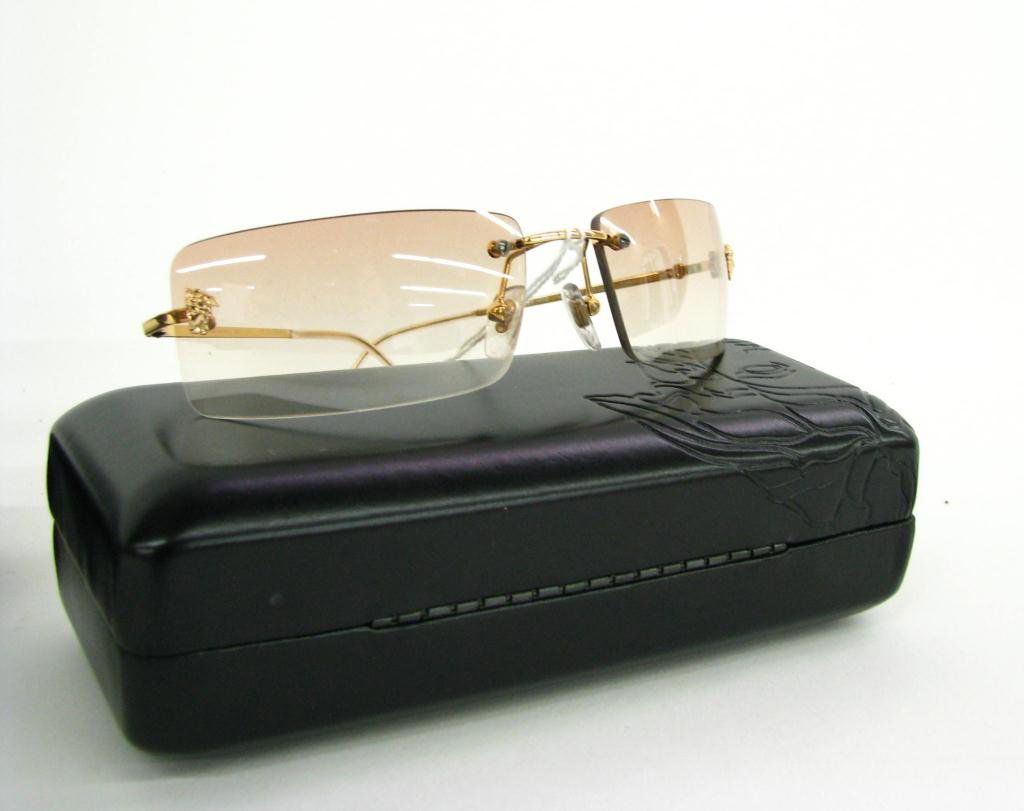 Gianni Versace Rimless Sunglasses: Gianni Versace rimless brown gradient lens with medusa head detail; ModN26, N30/S37 in original case