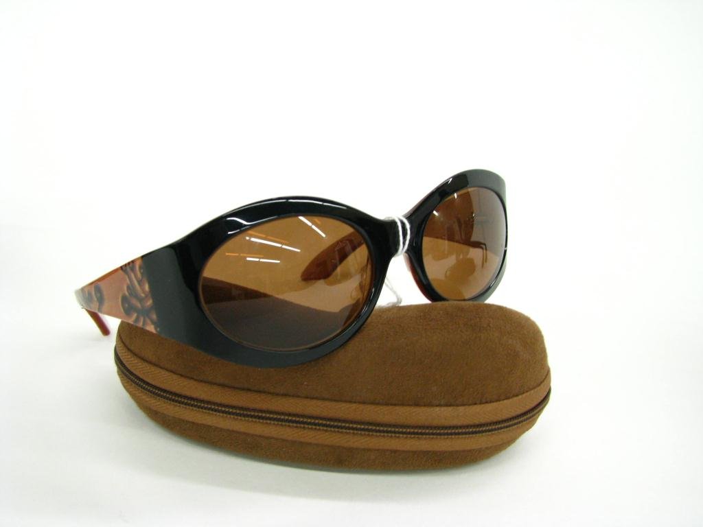 Kata Copper and Black Cat Eye Style Sunglasses: Kata copper and black oval cat eye style sunglasses; Model SEA2 NOI
