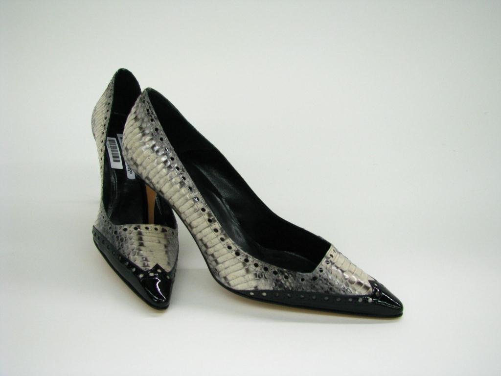 Manolo Blahnik Spectator Style Pointed Toe Pump: Manolo Blahnik snake skin and black patent leather spectator style pointed toe pump; heel 3 1/2", size 39.5
