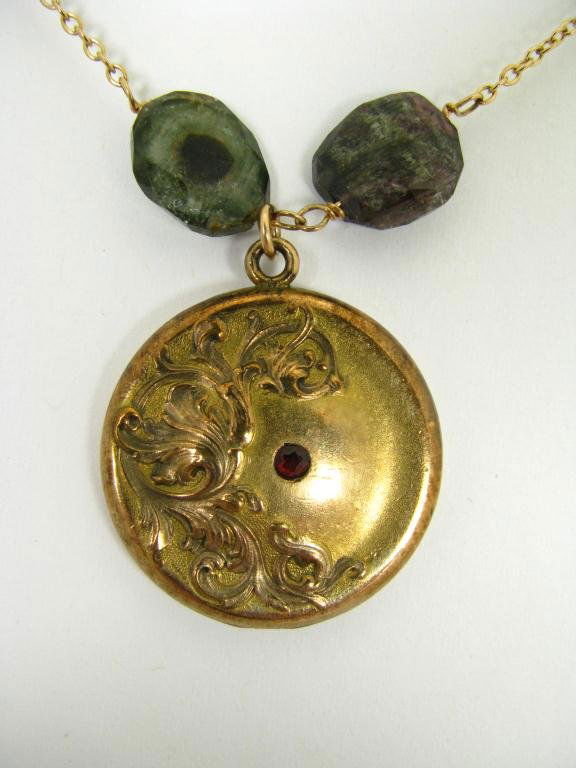 Piper Dano Designer Necklace with Vintage Locket: Piper Dano designer necklace with vintage locket. The 1 1/4" diameter gold filled locket is art nouveau in style and set with faceted ruby color stone. Inside the locket is stamped W & H Co. Locket is