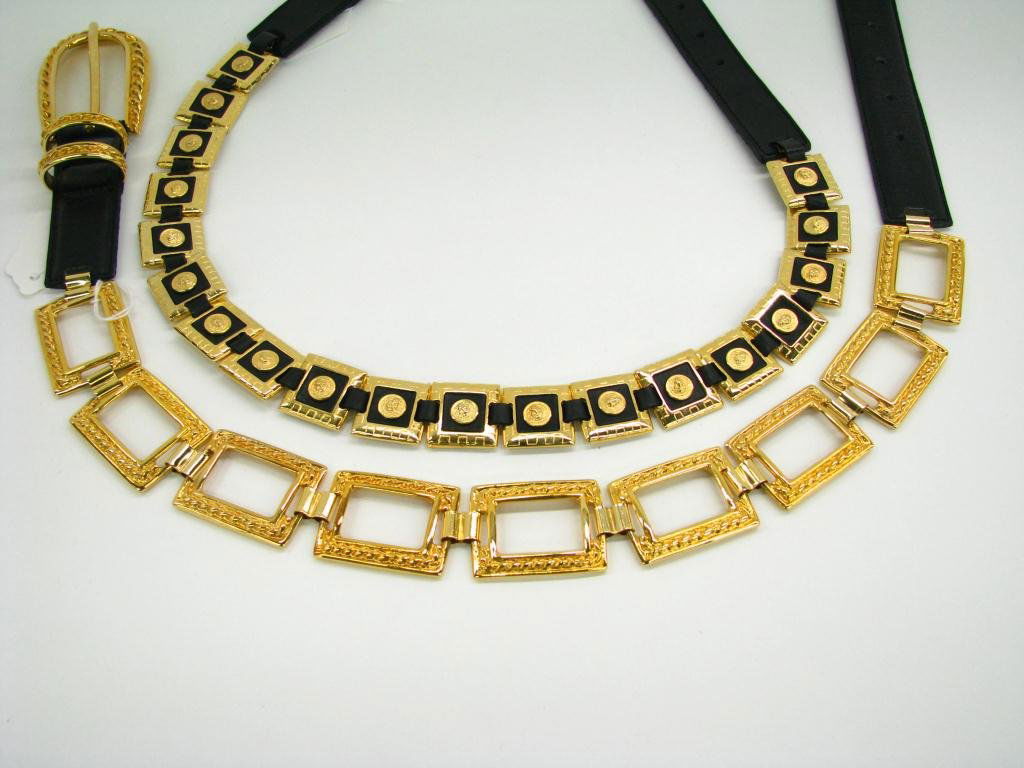 Two Versace Belts, Jean, Versus: Lot of two Versace belts: 1. Versace Jean Couture black leather square link belt; Size 42, 1 3/8" wide and 30" long and 2. Versus black leather square link with lion head detail; size 42, 1" wide and