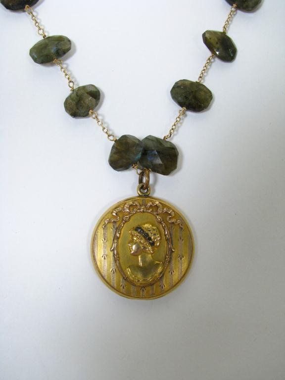 Piper Dano Designer Necklace with Vintage Locket: Piper Dano designer necklace with vintage locket. The 1 1.4" diameter gold filled locket is art deco style with flapper portrait. The portrait is set with black color stones and locket is stamped insi