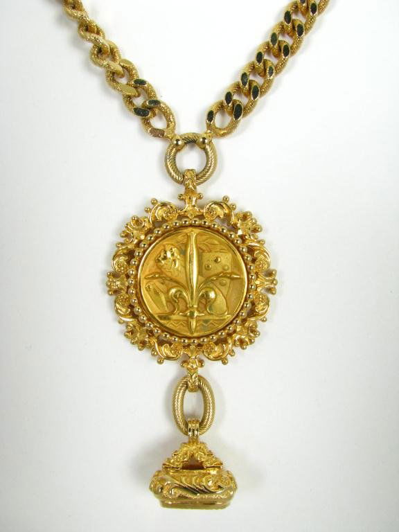 Nettie Rosenstein Vintage Chain with Medallion: Nettie Rosenstein vintage gold tone heavy link chain with ornate medallion. The chain is 22" long, 1/4" wide with fish hook clasp. Medallion is 1 3/4" in diameter with lion and fleur de lis design wit
