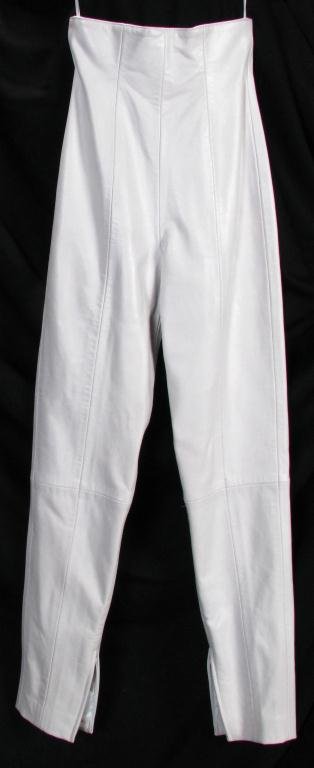 Two Pair of Michael Hoban North Beach Leather Pant: Lot of two Michael Hoban North Beach Leather pants: 1. white high waist straight leg pants with zip back and ankle zipper detail; size 3/4 and pair of black high waist straight leg pants with zip back