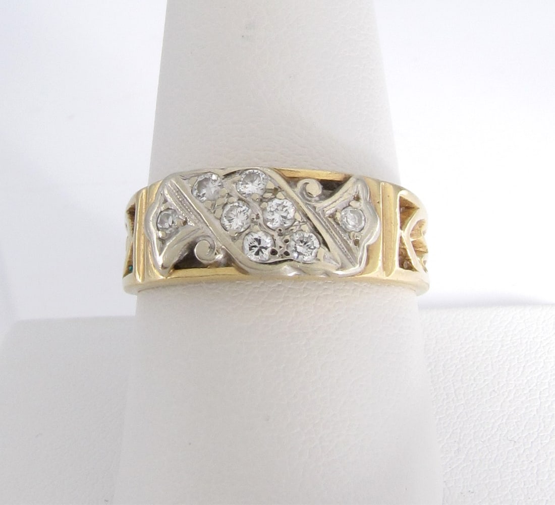 14K YG Kinsey & Sons Gent's Diamond Band: A 14K yellow gold band, by Kinsey & Sons, marked "Gothic" and 14K featuring eight round white diamonds in top mount. Size 10. Ring weight 3.7dwt.
