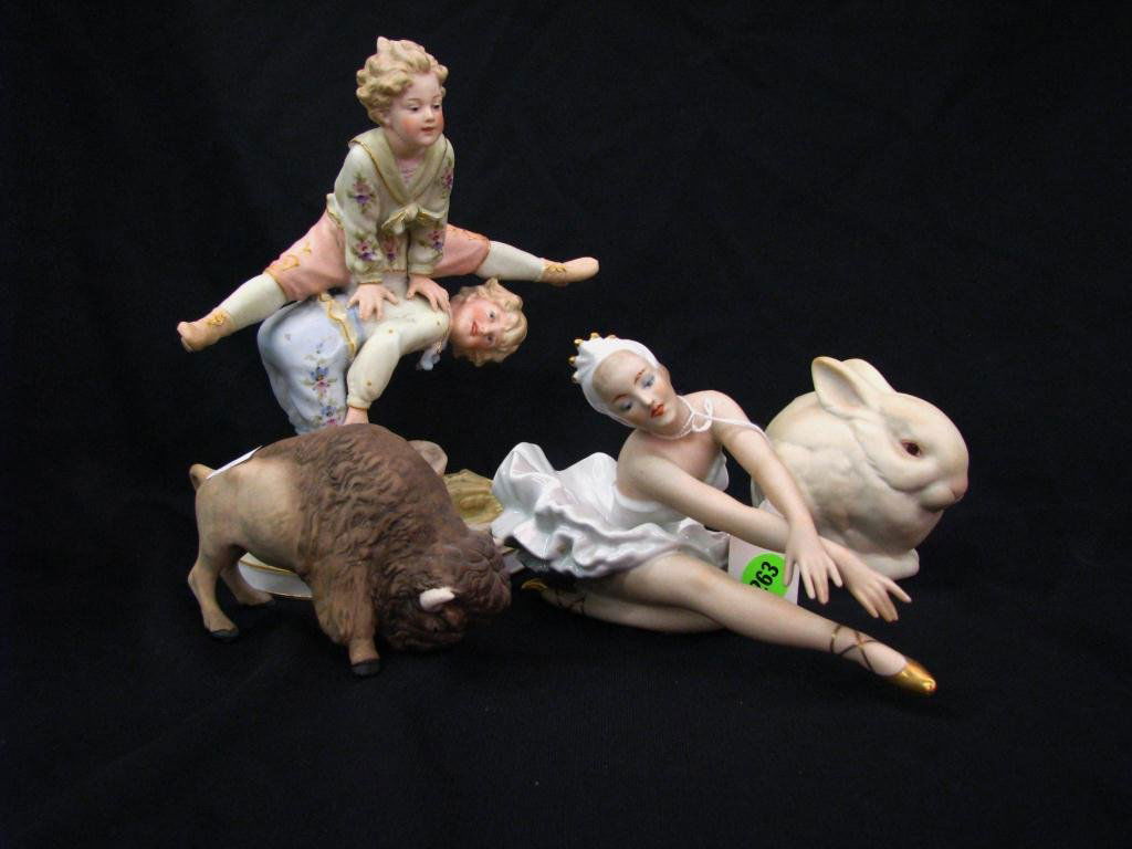Group of Porcelain Figures, Cybis: A group of porcelain figures, including Cybis rabbit, Cybis buffalo, Cybis girl with doll (damaged), a reproduction Dresden dancer, and an unmarked figural grouping with boy and girl