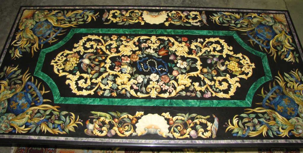 Vintage, Signed, Inlaid Italian Dining Table: A vintage Italian inlaid stone and paint decorated granite dining table, circa mid 20th century, depicting flora and fauna and various birds and animals, signed 'S Cavatorta-Roma' on border, on a pain