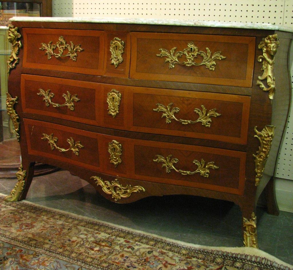Vintage French Style Marble Top Dresser: A vintage, French Bombe style marble top dresser, two over two drawers, cast metal figural ormolu, handles and escutcheons, circa mid 20th century