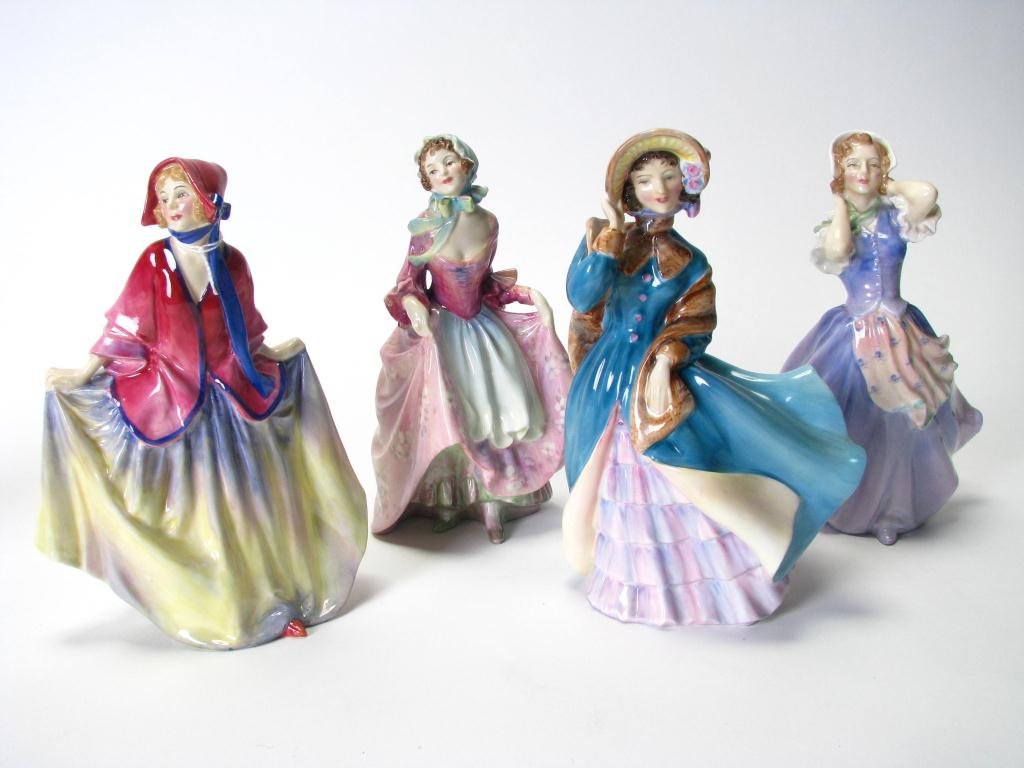 Group of Four Royal Doulton Porcelain Figurines: A Group of Four Royal Doulton Porcelain Figurines, including "Delphine" (HN 2137), "Sweet Anne" (HN 1331), "Betsy" (2111), and "Suzette"(1487)