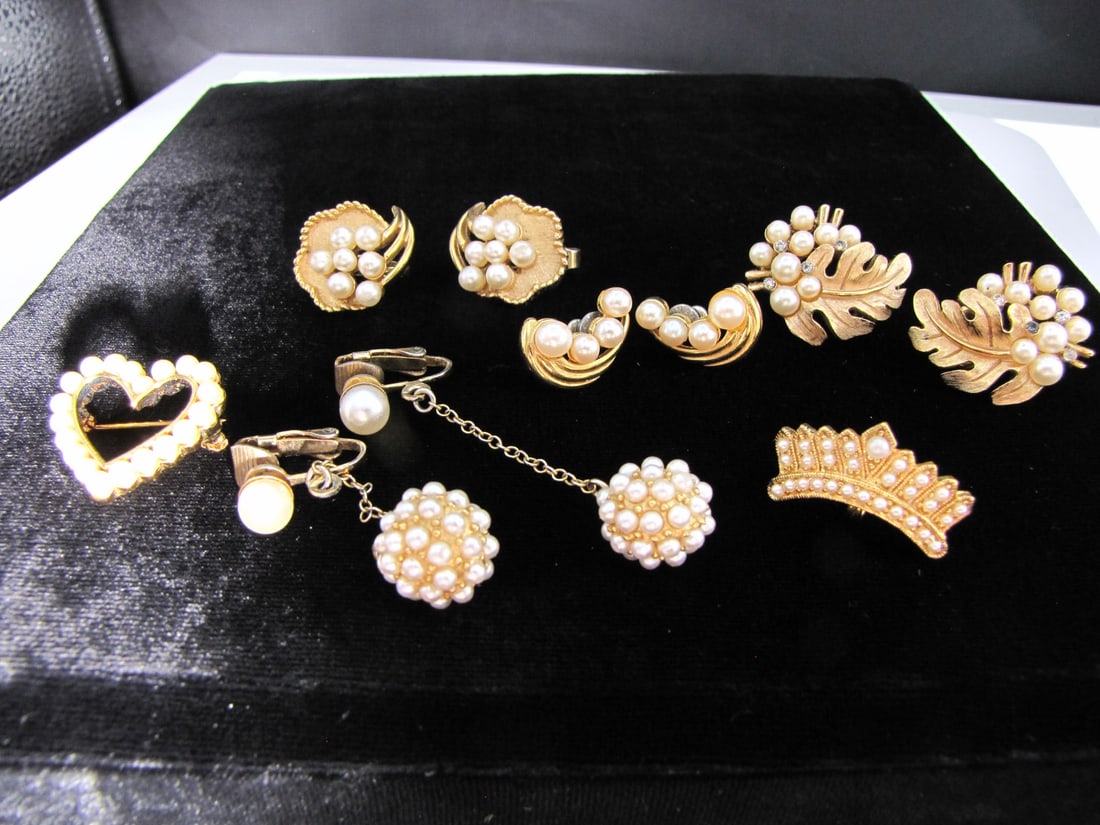 Group of Designer Costume Jewelry: A group of designer costume faux pearl jewelry including two pair of Trifari non pierced earrings; a pair of Richelieu pierced earrings; a Monet heart brooch; an unmarked tiara brooch; and an unmarked