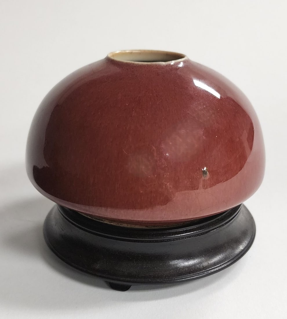 Antique Chinese Sang de Boeuf Brush Pot: An antique Chinese Sang de Boeuf brush pot, circa late 18th century, 2.75" high, good condition, oxblood glaze, with rosewood stand