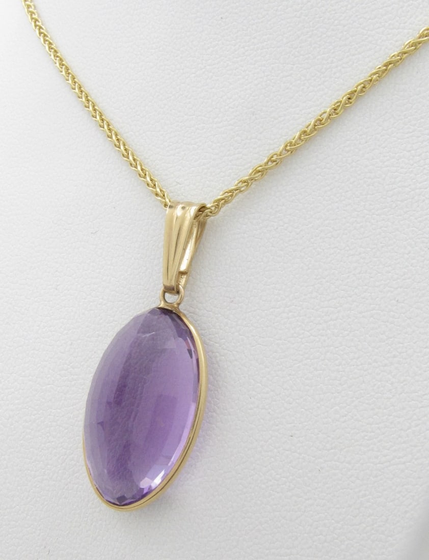 Large Oval Amethyst, 14K YG Pendant, Chain: A large, 23mm x 13mm oval faceted amethyst set in a 14K yellow gold open back bezel, on a 14K yellow gold, 20" wheat chain. Necklace weight in gold is 5dwt. Very nice necklace.
