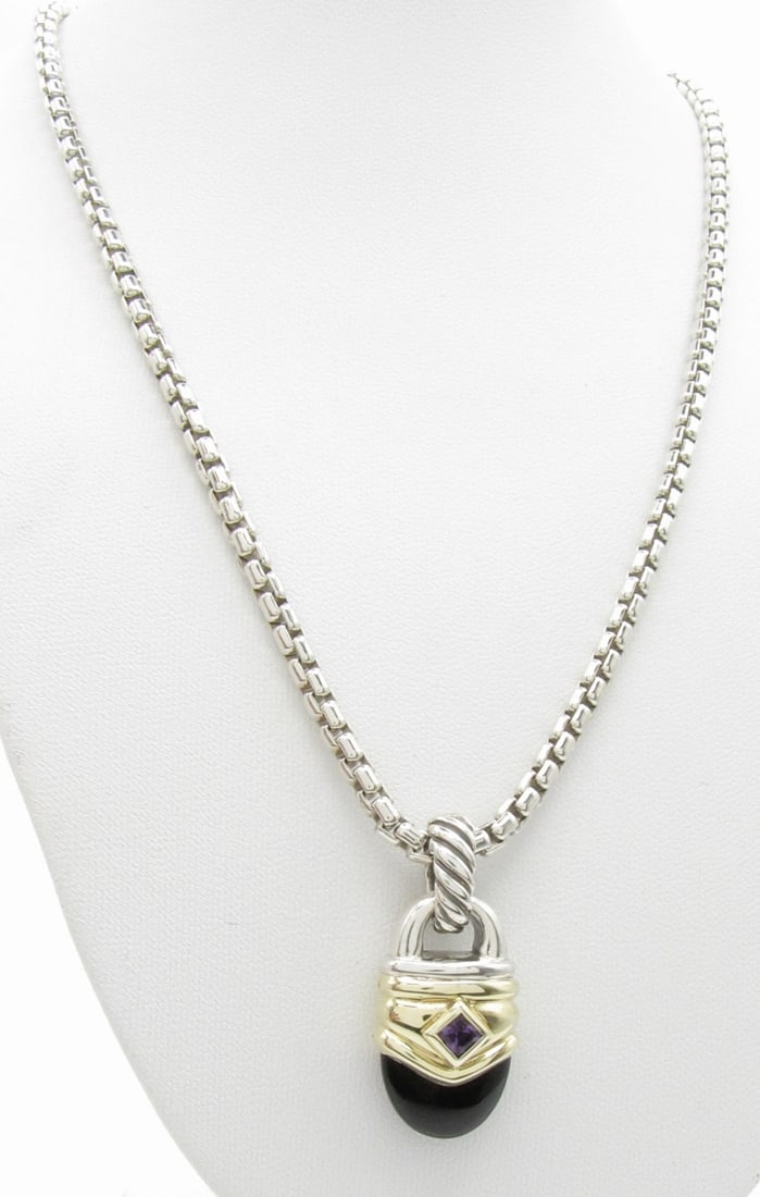 David Yurman Acorn Enhancer, Onyx, Amethyst, Chain: A David Yurman sterling silver Acorn pendant/enhancer measuring 1.63" x .56" featuring a cabochon natural onyx and amethyst set in 14K yellow gold mounting. On a 16" long David Yurman box chain in ste