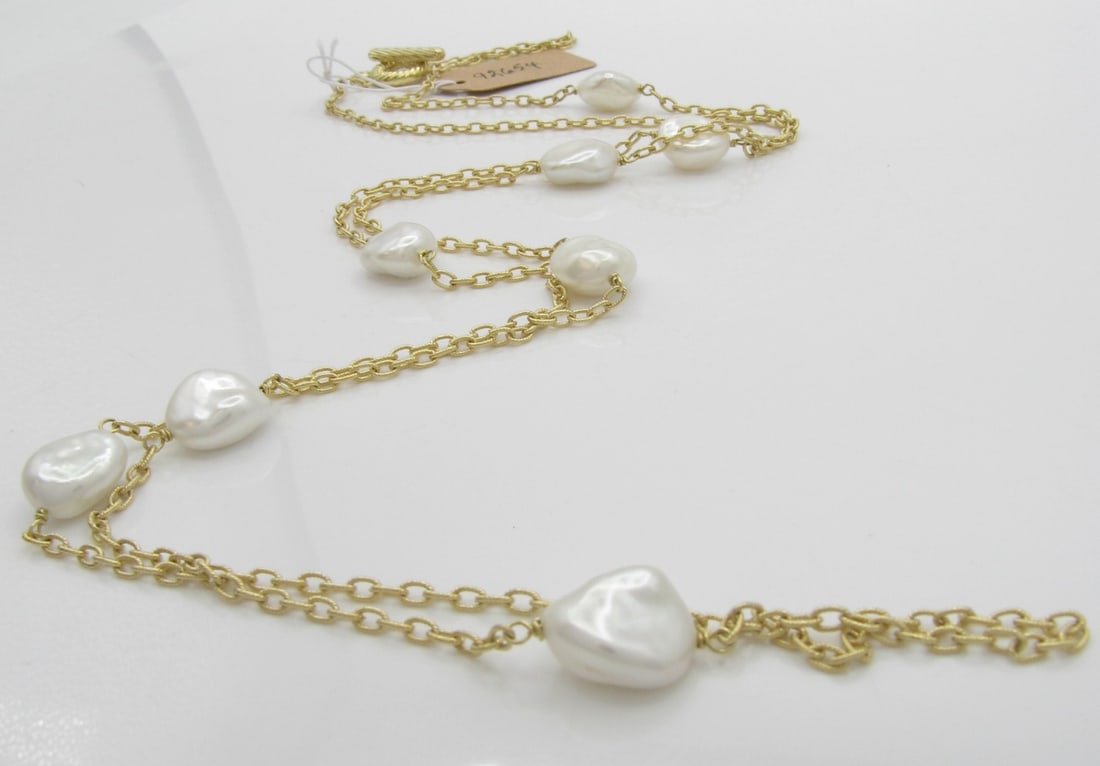 18K Yellow Gold David Yurman 36" Chain with Pearl: A David Yurman 18K yellow gold 36" long link chain with toggle clasp featuring eight approximately 11mm x 12mm irregular shape freshwater pearls, Necklace weight 16dwt. Retail $7,950.